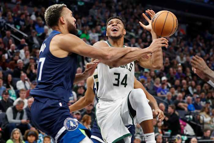 Minnesota Timberwolves center Rudy Gobert (27) fouls Milwaukee Bucks forward Giannis Antetokounmpo (34)